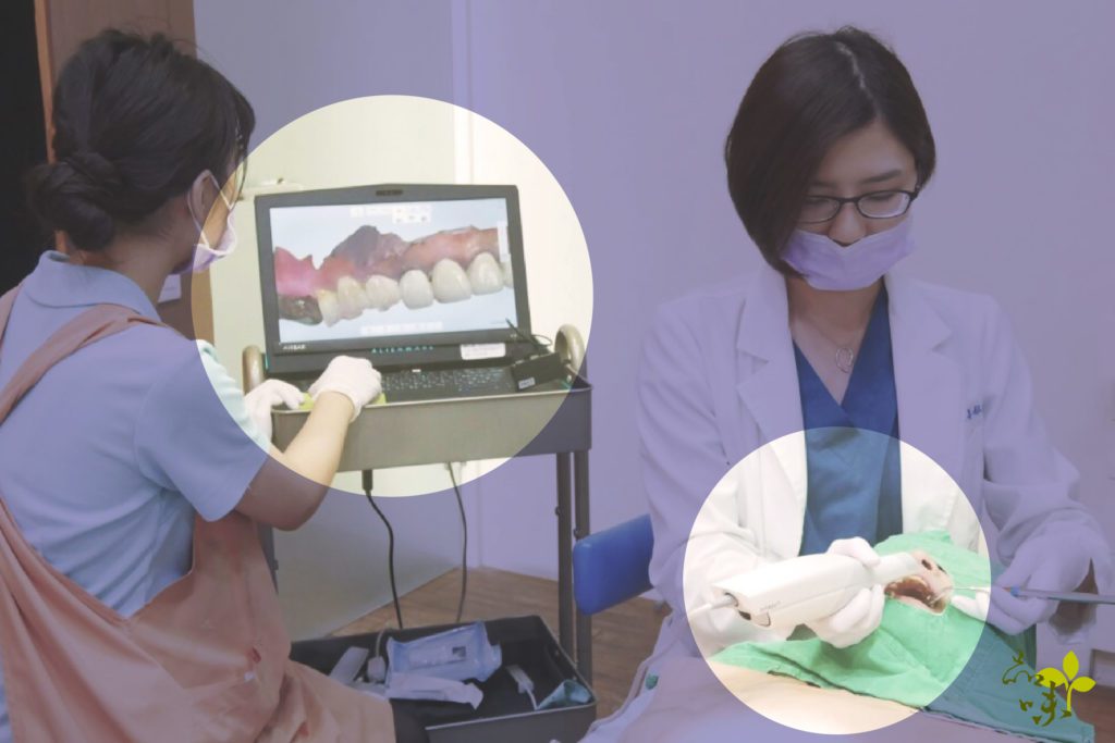 醫師用口掃機幫患者掃描牙齒